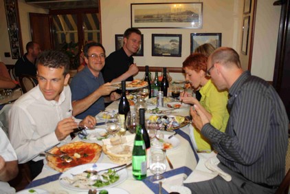 Group enjoying italian dinner